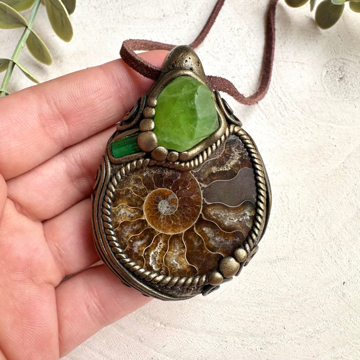 Mineral specimen inspired crystal necklace with ammonite fossil and green tourmaline gemstones