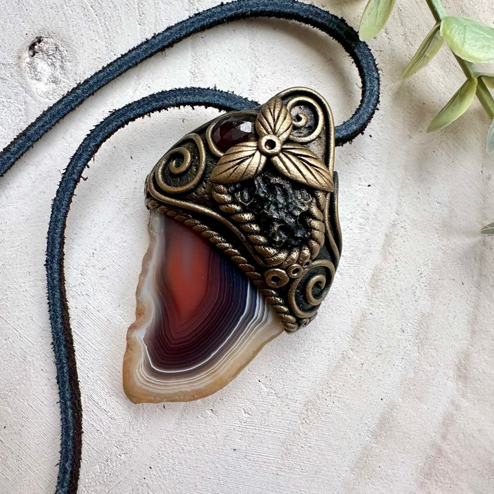 Botswana agate paired with moldavite and red garnet