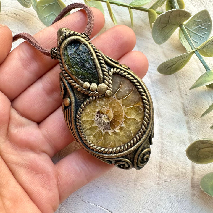 Energy pendant with moldavite and ammonite fossil