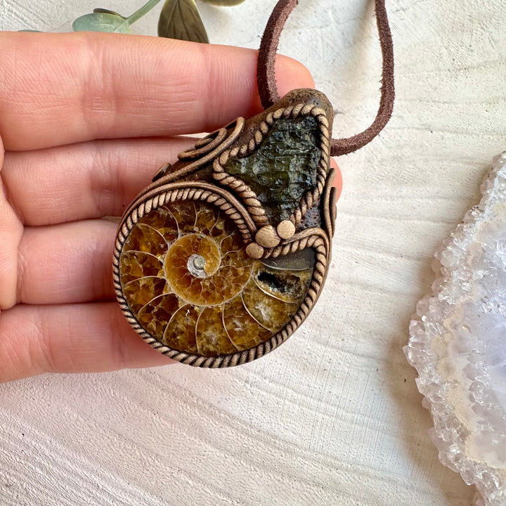 Moldavite and ammonite fossil pendant necklace