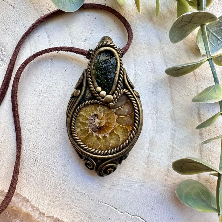 Handmade necklace with ammonite fossil and raw moldavite