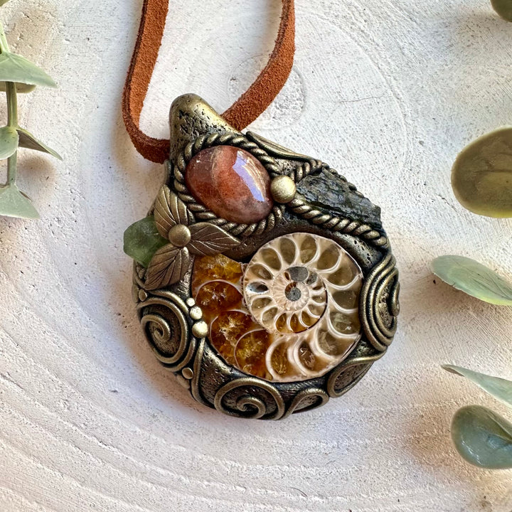 Handmade crystal jewelry with natural Ammonite, Sunstone, Peridot and Moldavite.