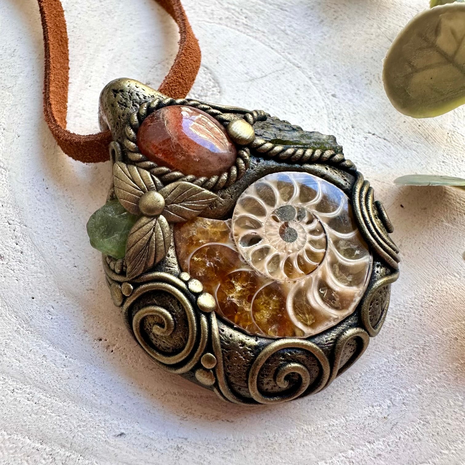 Unique handmade unisex necklace with Ammonite, Sunstone, Moldavite and Peridot natural gemstone details.
