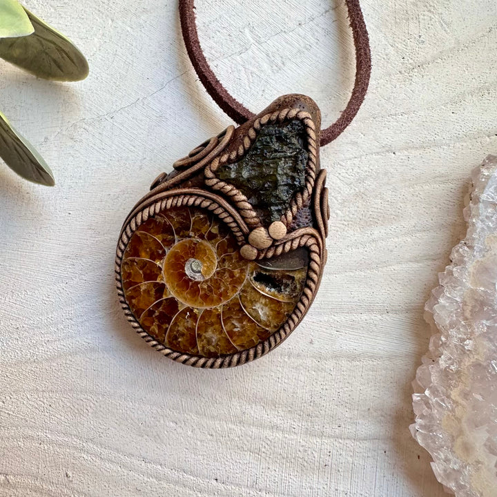 Healing crystal pendant with moldavite and ammonite