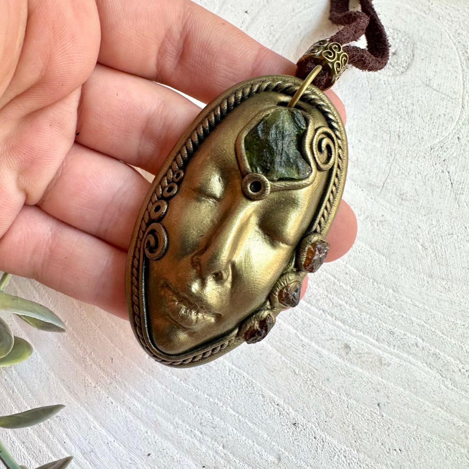 Handmade Goddess pendant featuring Moldavite and Hessonite Garnet natural gemstones.