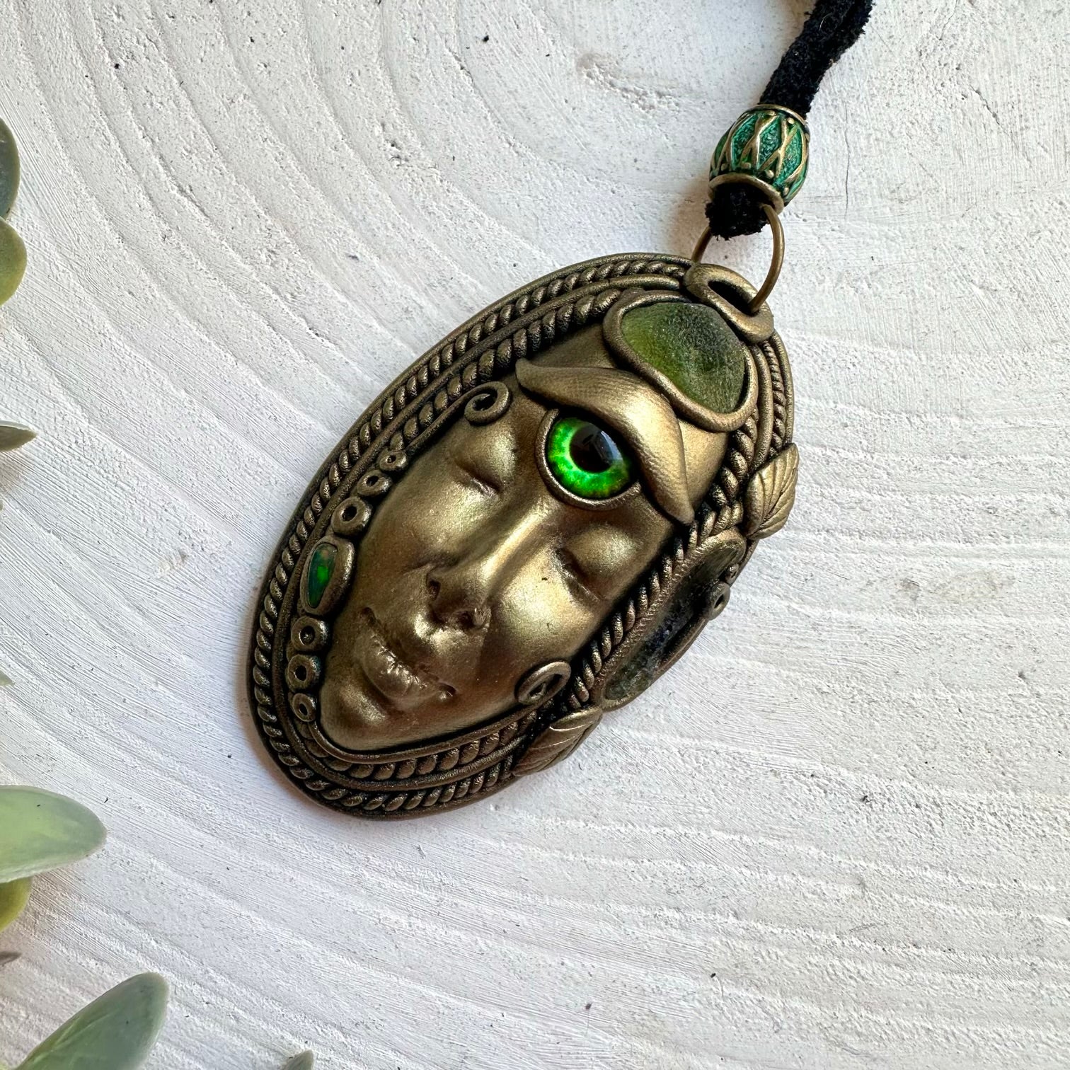 Statement gemstone jewelry combining bright green Peridot with natural Moldavite and dark Opal.