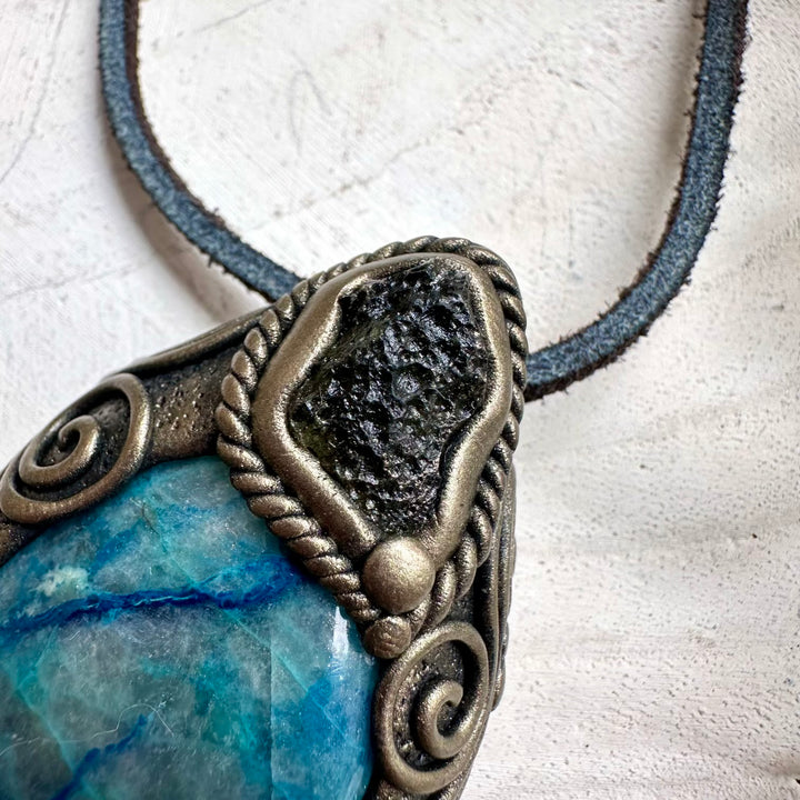 Quantum quattro paired with raw moldavite in a necklace