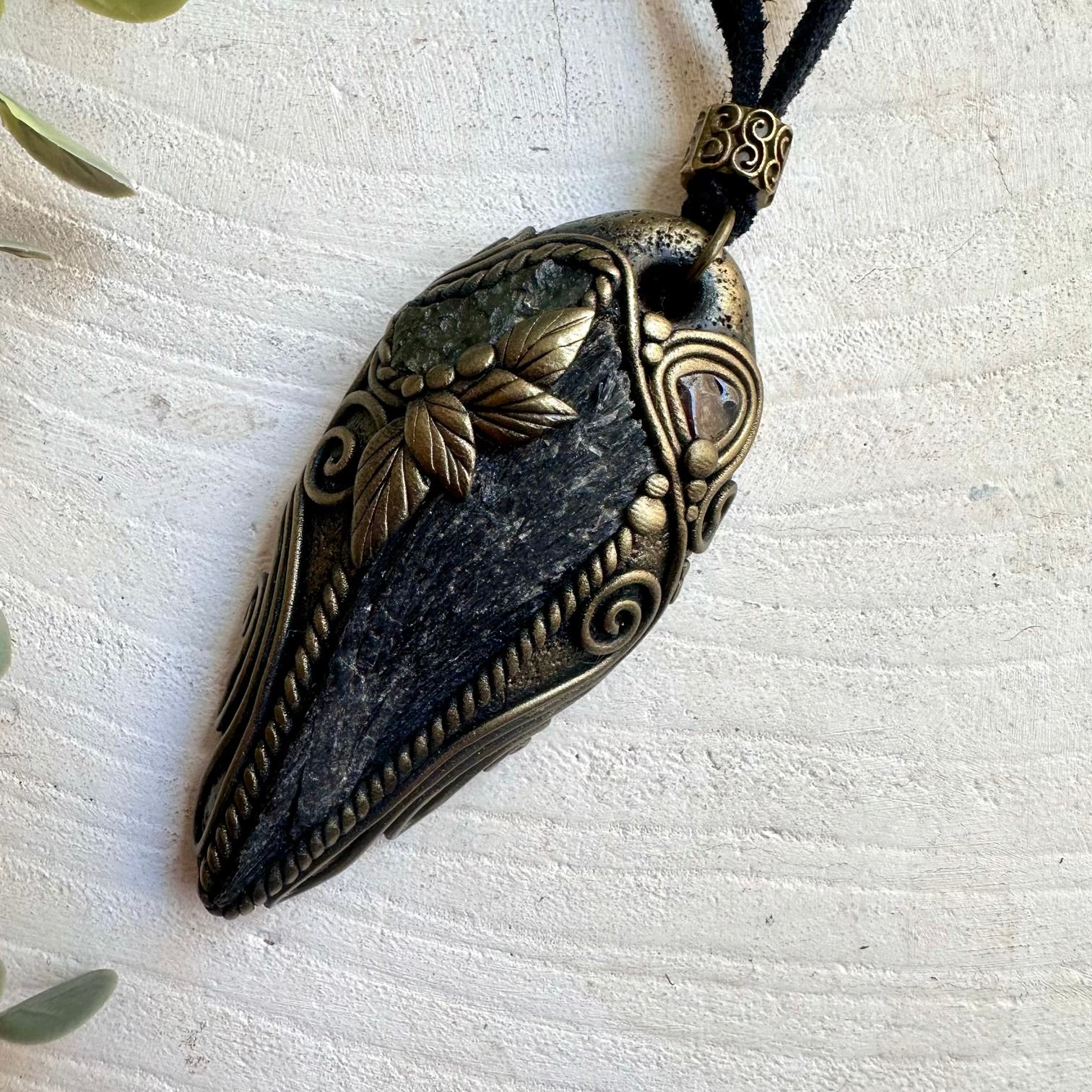 Crystal talisman necklace made with Black Kyanite, Moldavite and Red Garnet gemstones.