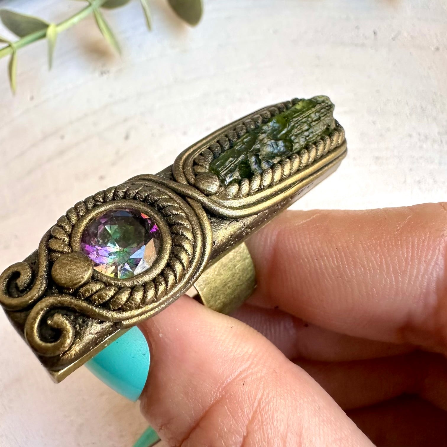 Spiritual jewelry ring combining moldavite and mystic topaz