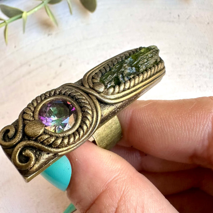Spiritual jewelry ring combining moldavite and mystic topaz