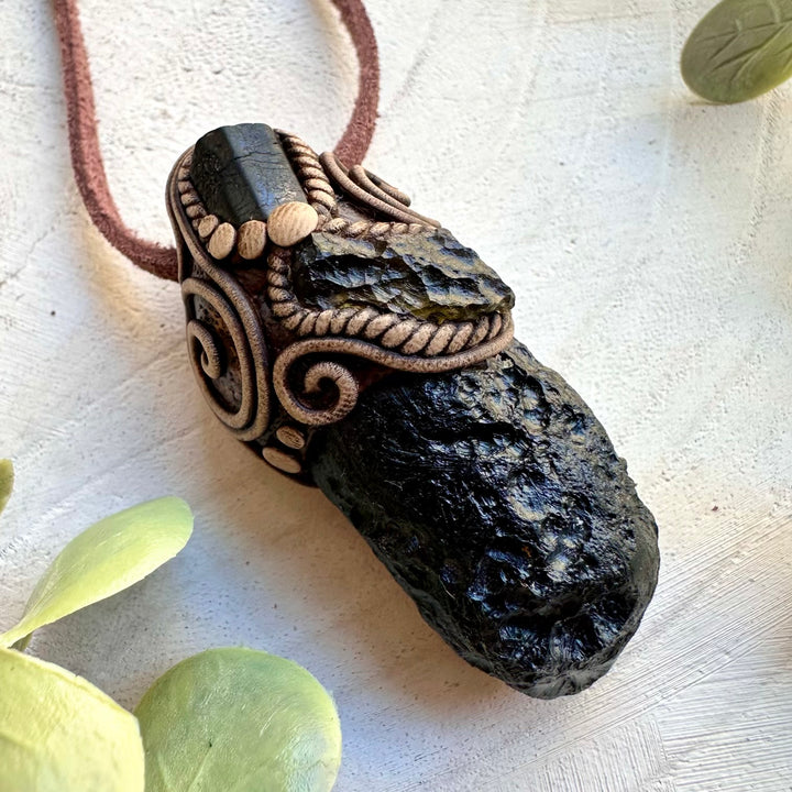 Energy healing pendant with black tektite and moldavite