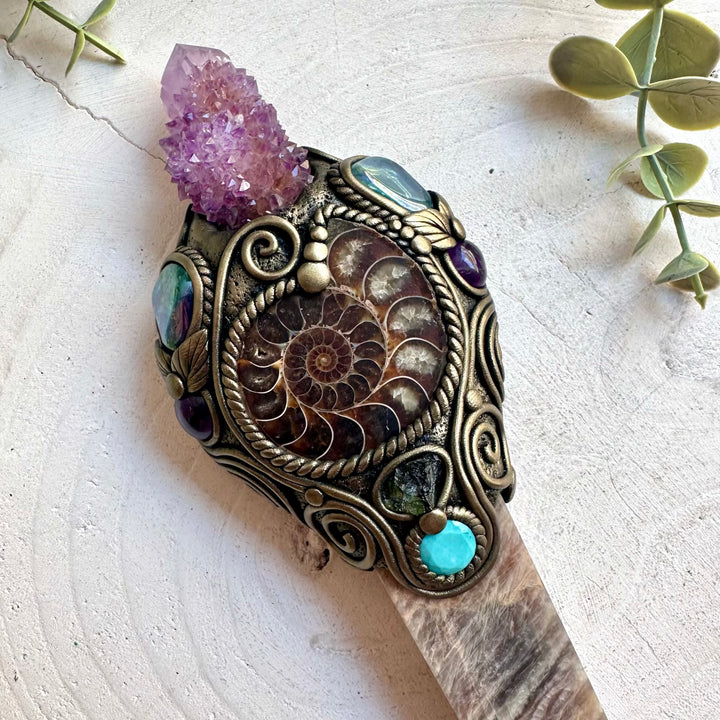 Handmade Moonstone Point crystal wand featuring Deep Purple Spirit Quartz, Ammonite, Aqua Aura Quartz, Amethyst, Amazonite and Moldavite, a one of a kind healing energy tool designed for intuition, transformation, spiritual awakening and inner balance. Artisan crystal wand crafted with genuine natural gemstones and ancient Earth treasures.
