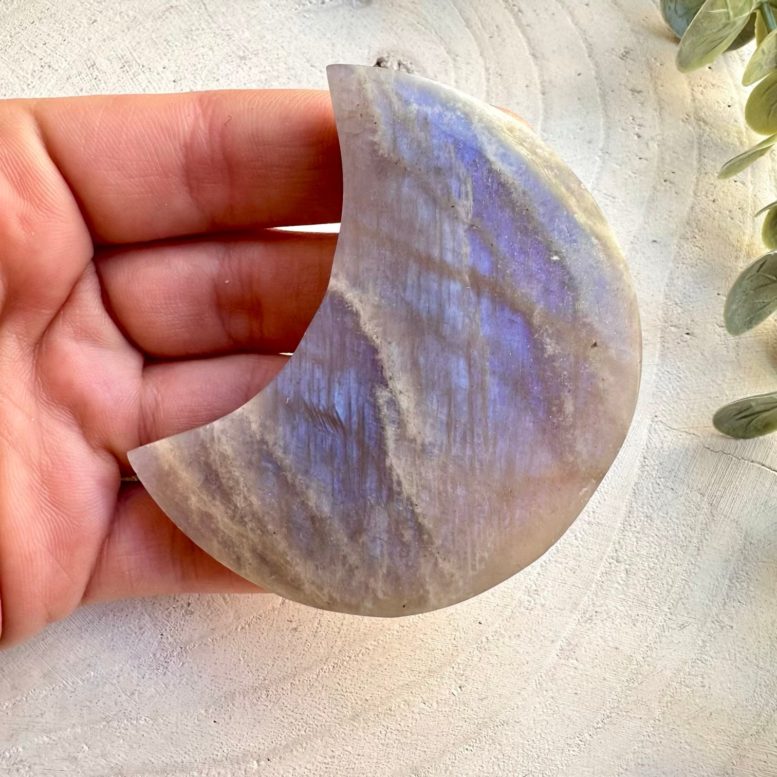 Close up of natural moonstone moon carving