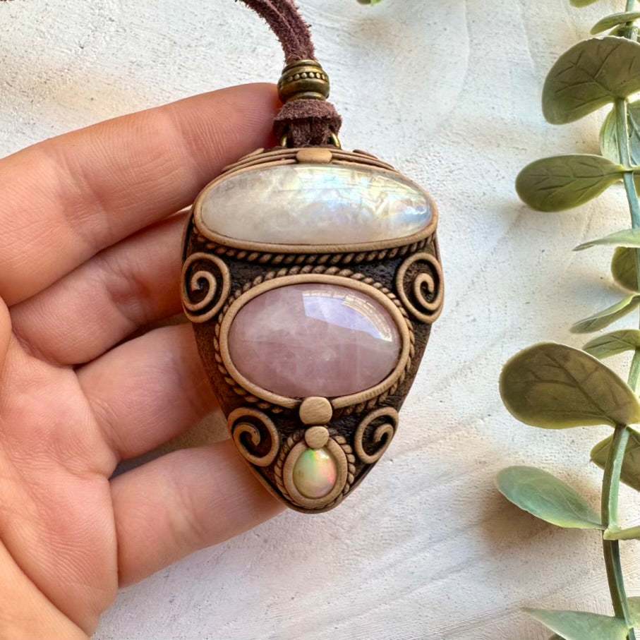 Spiritual gemstone necklace featuring rainbow moonstone rose quartz and opal