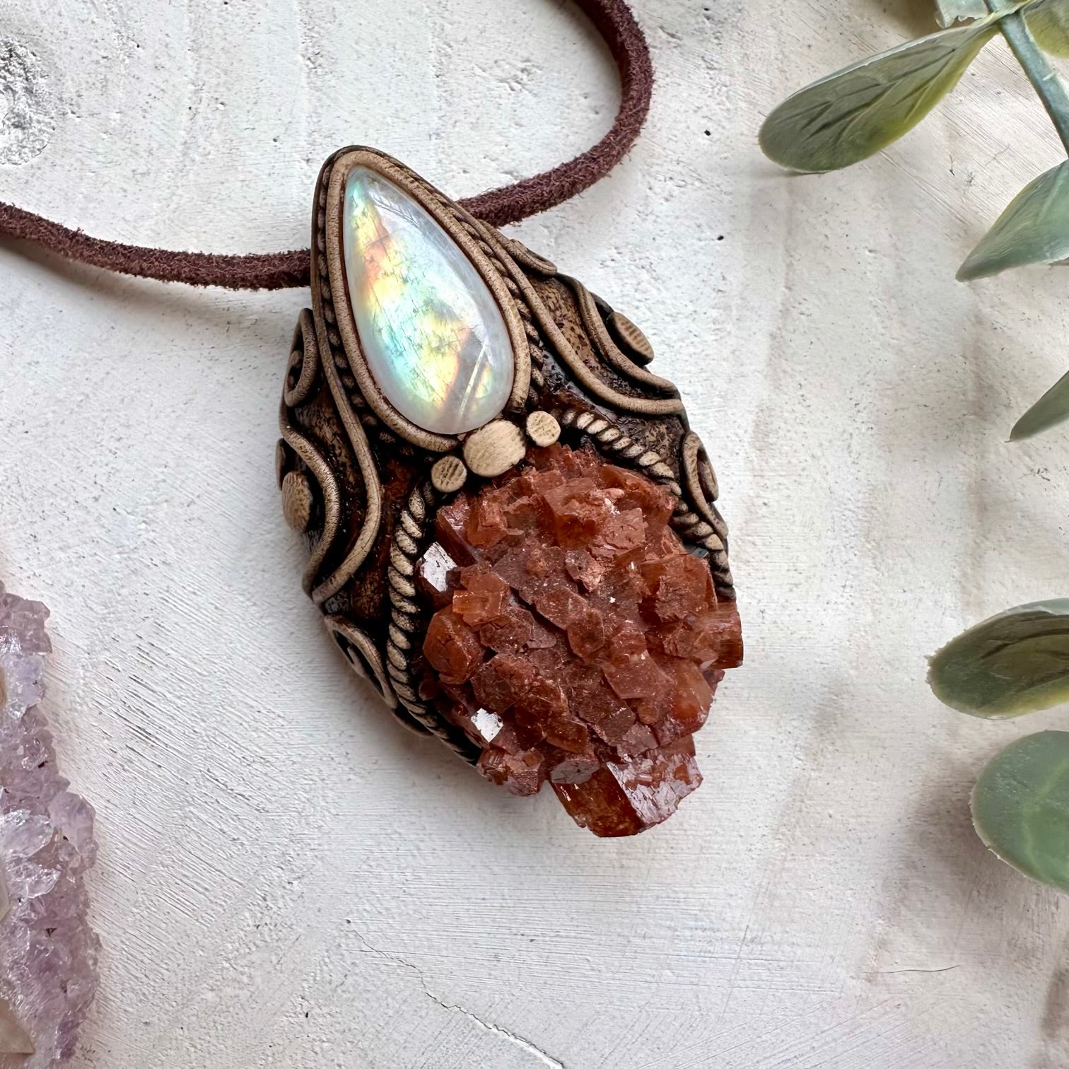 Aragonite paired with rainbow moonstone in a necklace
