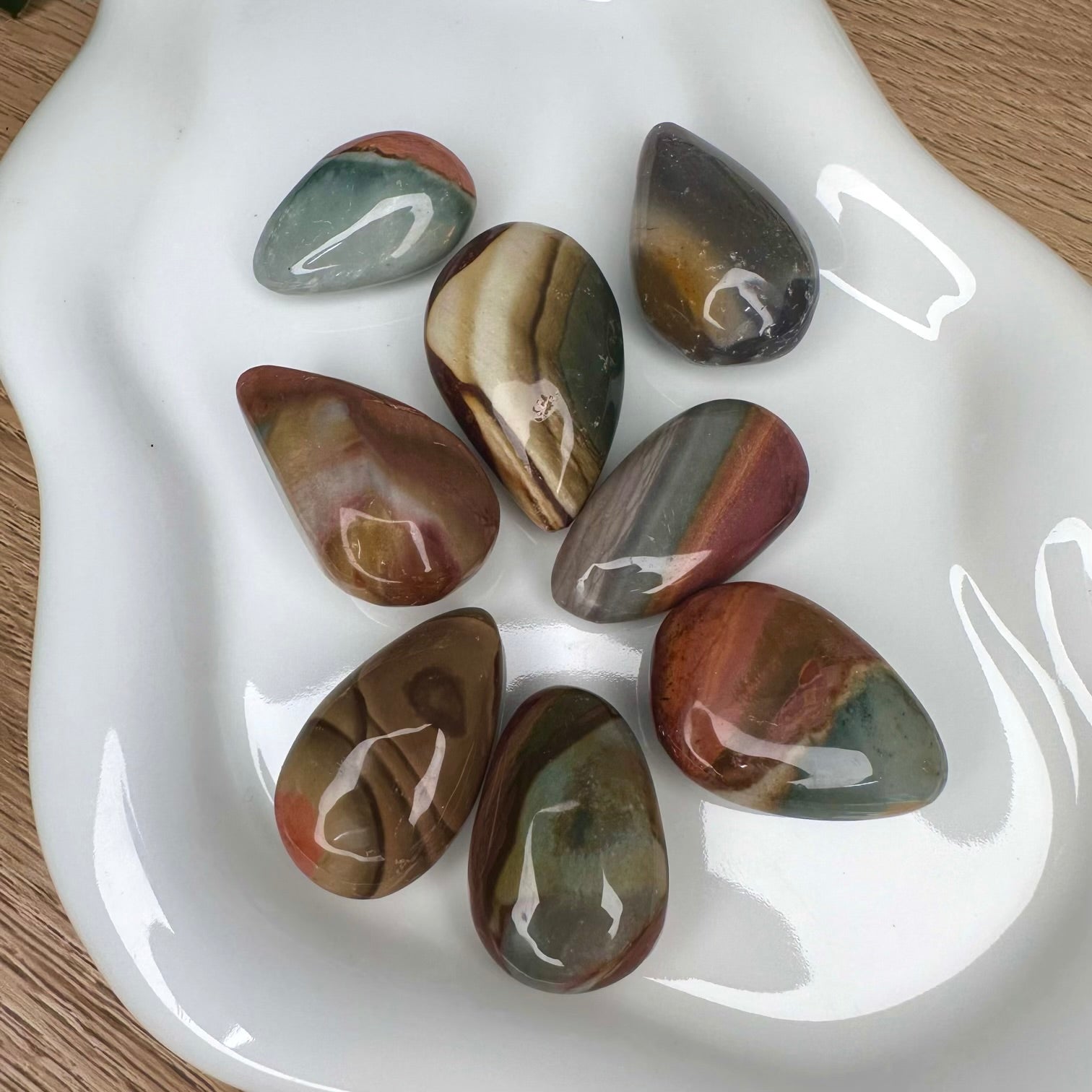 Close up of polished jasper drop shaped stone