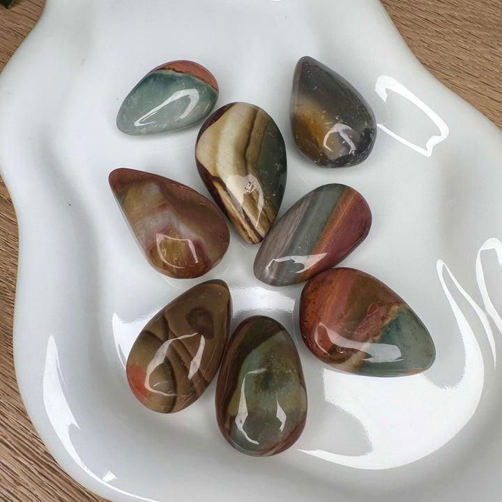Close up of polished jasper drop shaped stone