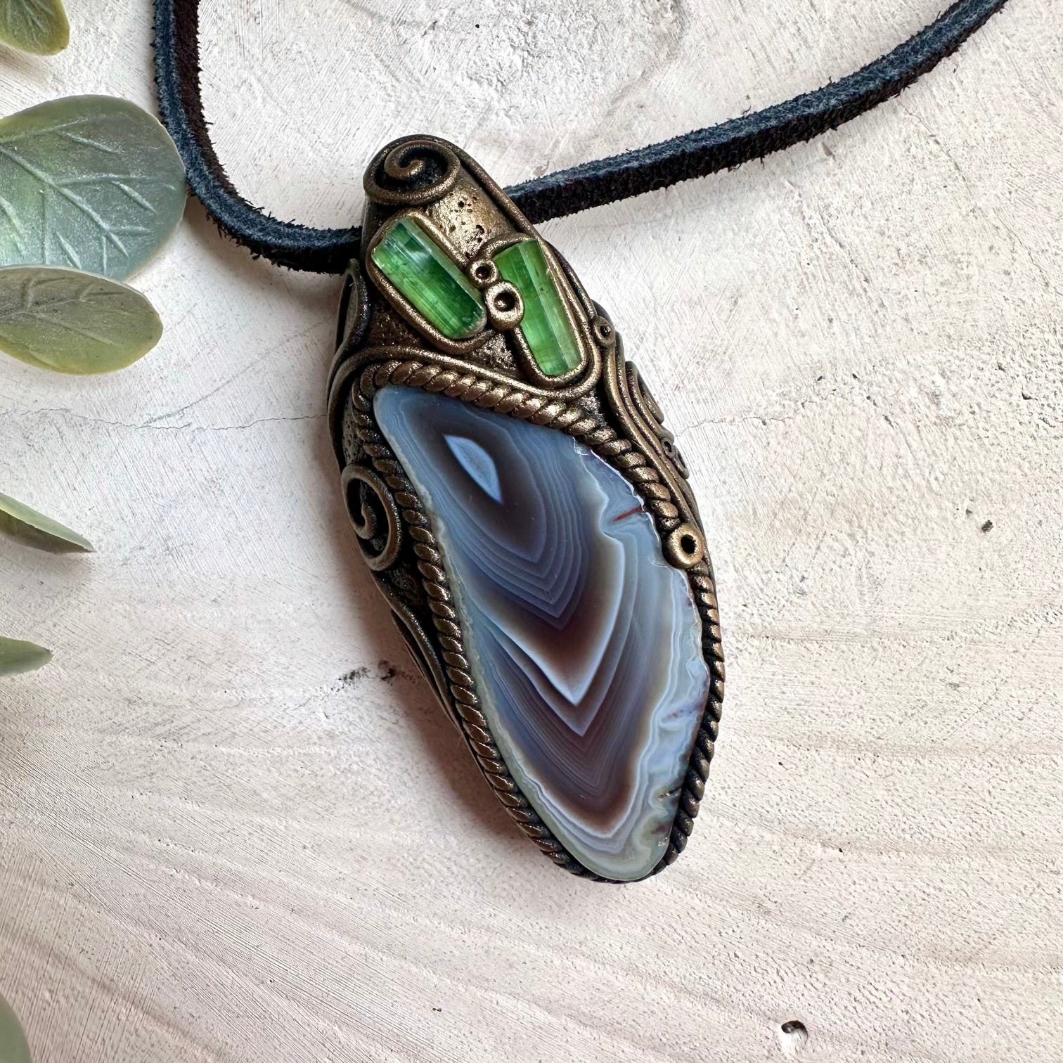 Handmade gemstone jewelry featuring Botswana Agate and Green Tourmaline for spiritual protection and luck.