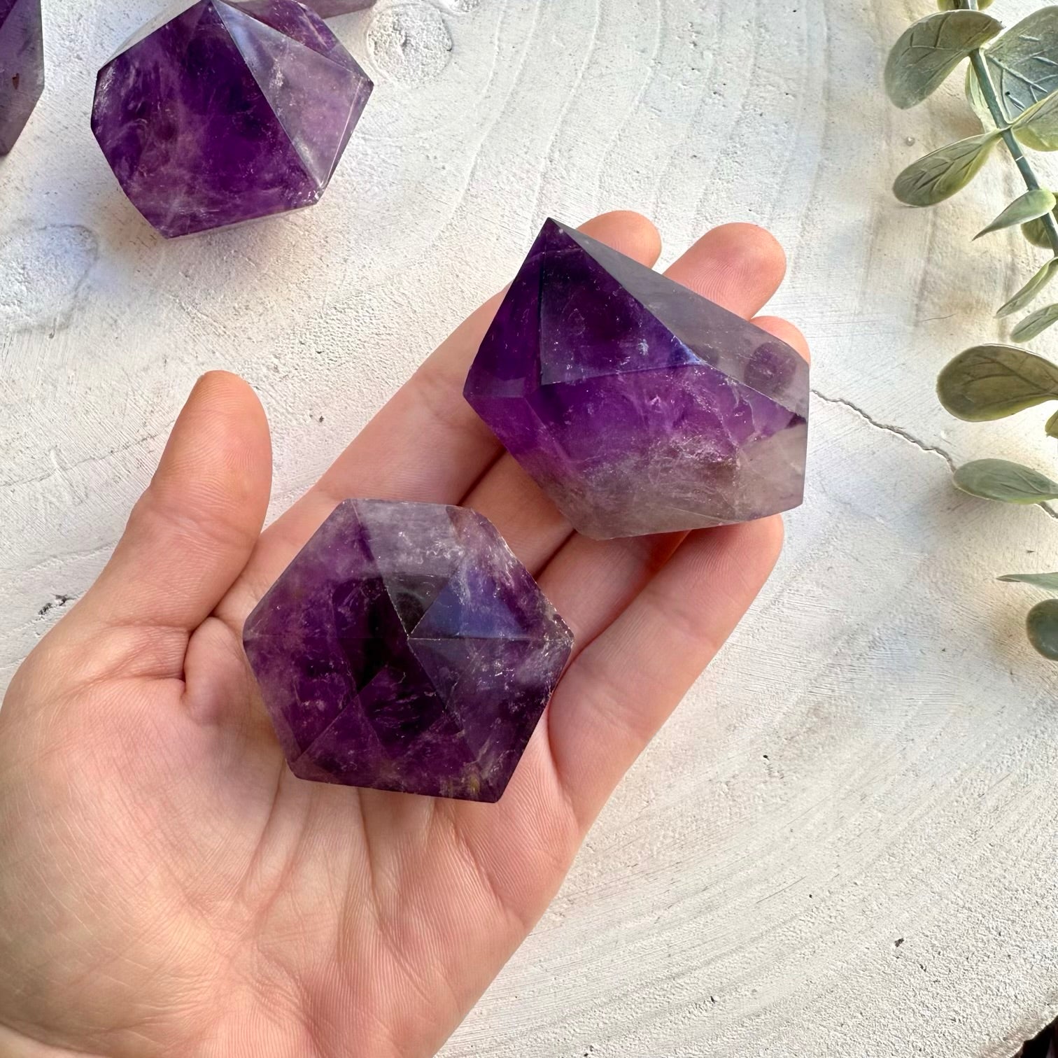 Close up of polished natural amethyst crystal point