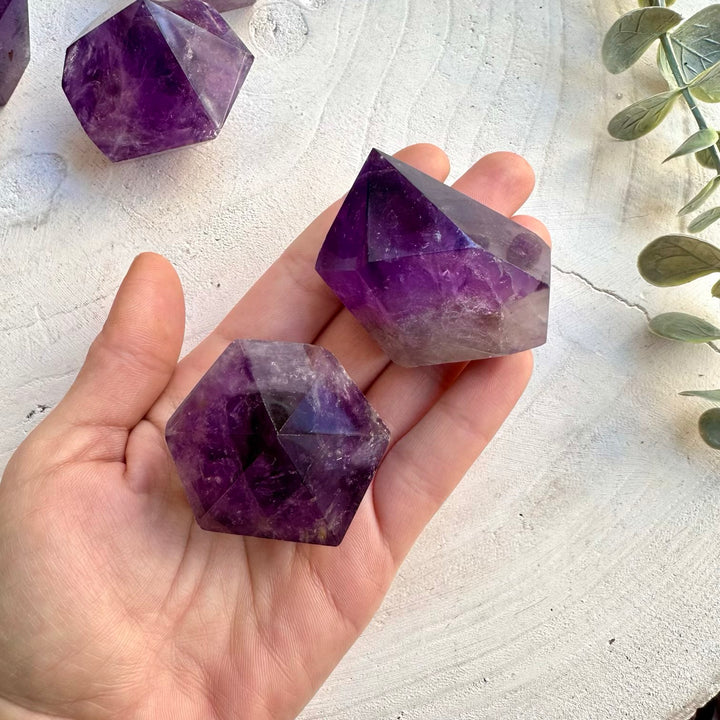Close up of polished natural amethyst crystal point