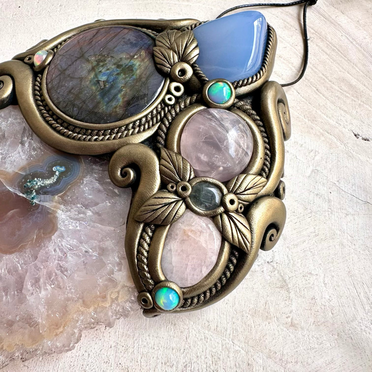 Large Amethyst Stalactite forms the centerpiece of this unique spiritual home decor with Purple Labradorite and colorful Ethiopian Opal.