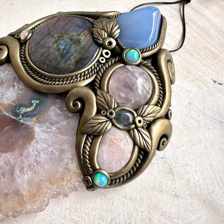 Large Amethyst Stalactite forms the centerpiece of this unique spiritual home decor with Purple Labradorite and colorful Ethiopian Opal.