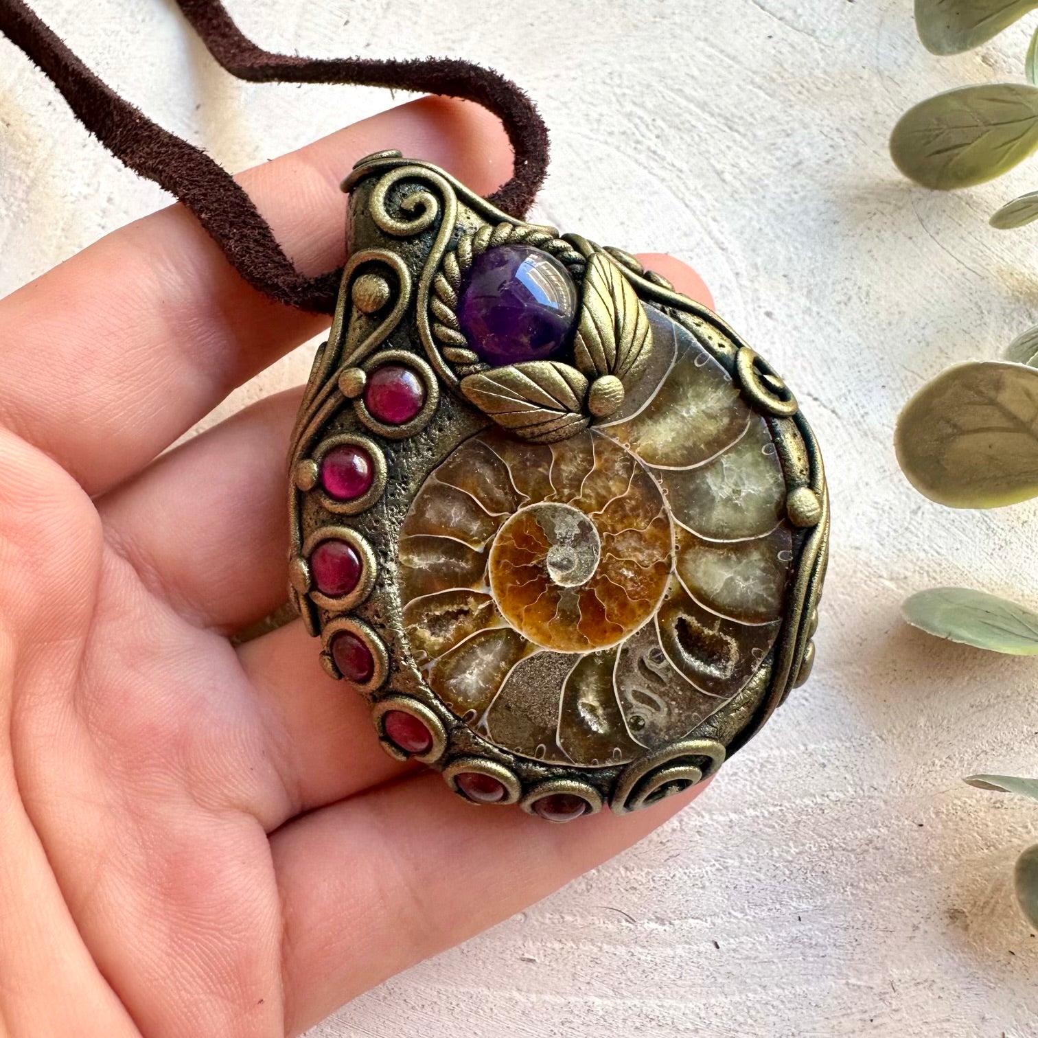 One of a kind pendant with a natural Ammonite fossil, purple Amethyst and deep red Rhodolite Garnet.