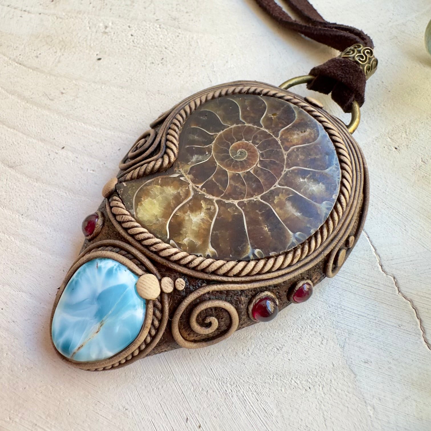 Natural fossil pendant with Larimar and garnet gemstones