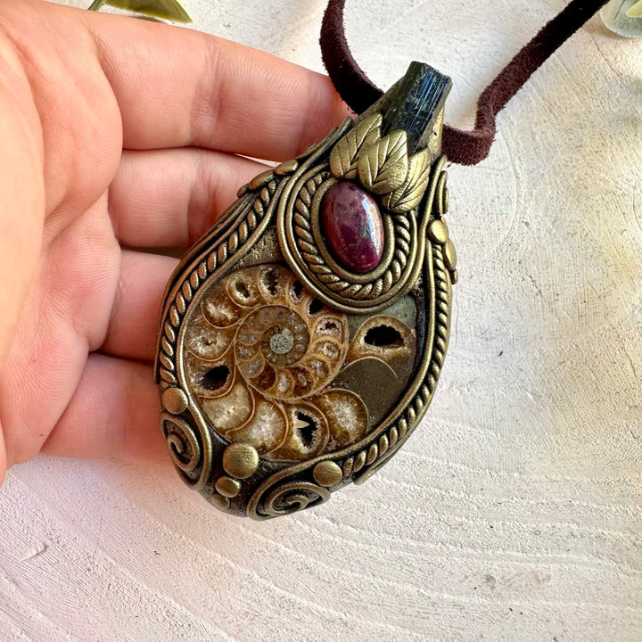 One of a kind necklace with a natural Ammonite fossil, Black Tourmaline and Ruby gemstones.