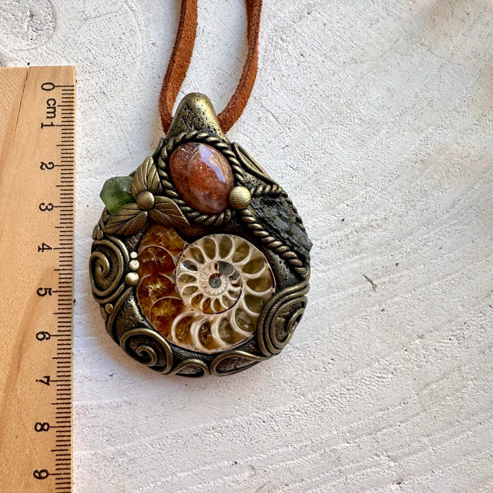 Handmade unisex necklace featuring Ammonite, Sunstone, Moldavite and Peridot natural gemstones.