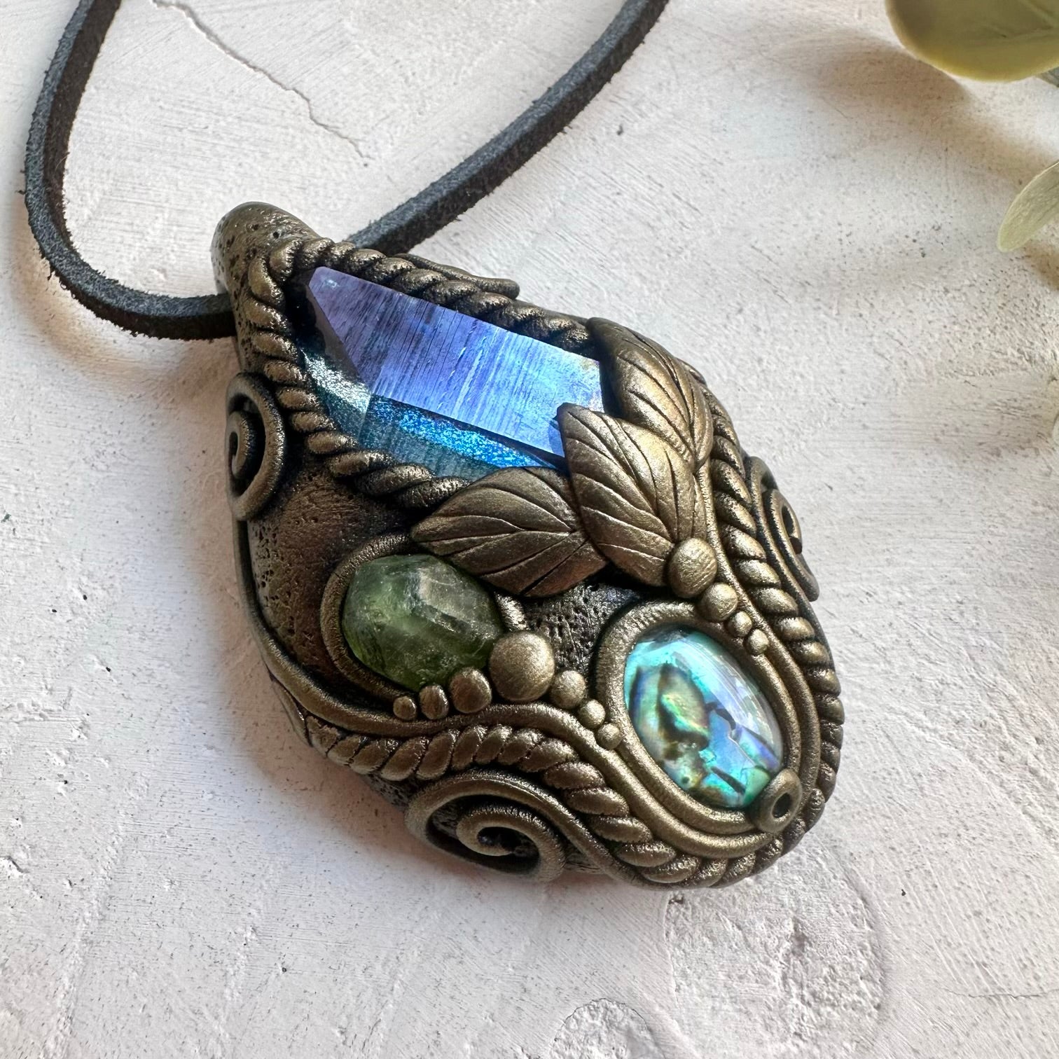 Natural gemstone jewelry showcasing Aqua Aura Quartz with a beautiful Abalone Seashell detail.
