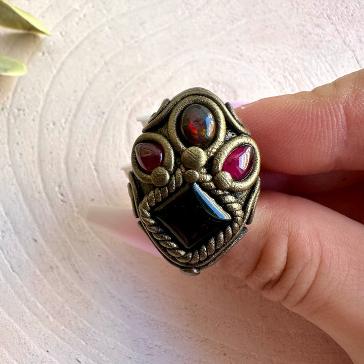 Spiritual crystal ring handcrafted with Black Onyx, Black Ethiopian Opal and Rhodolite Garnet.