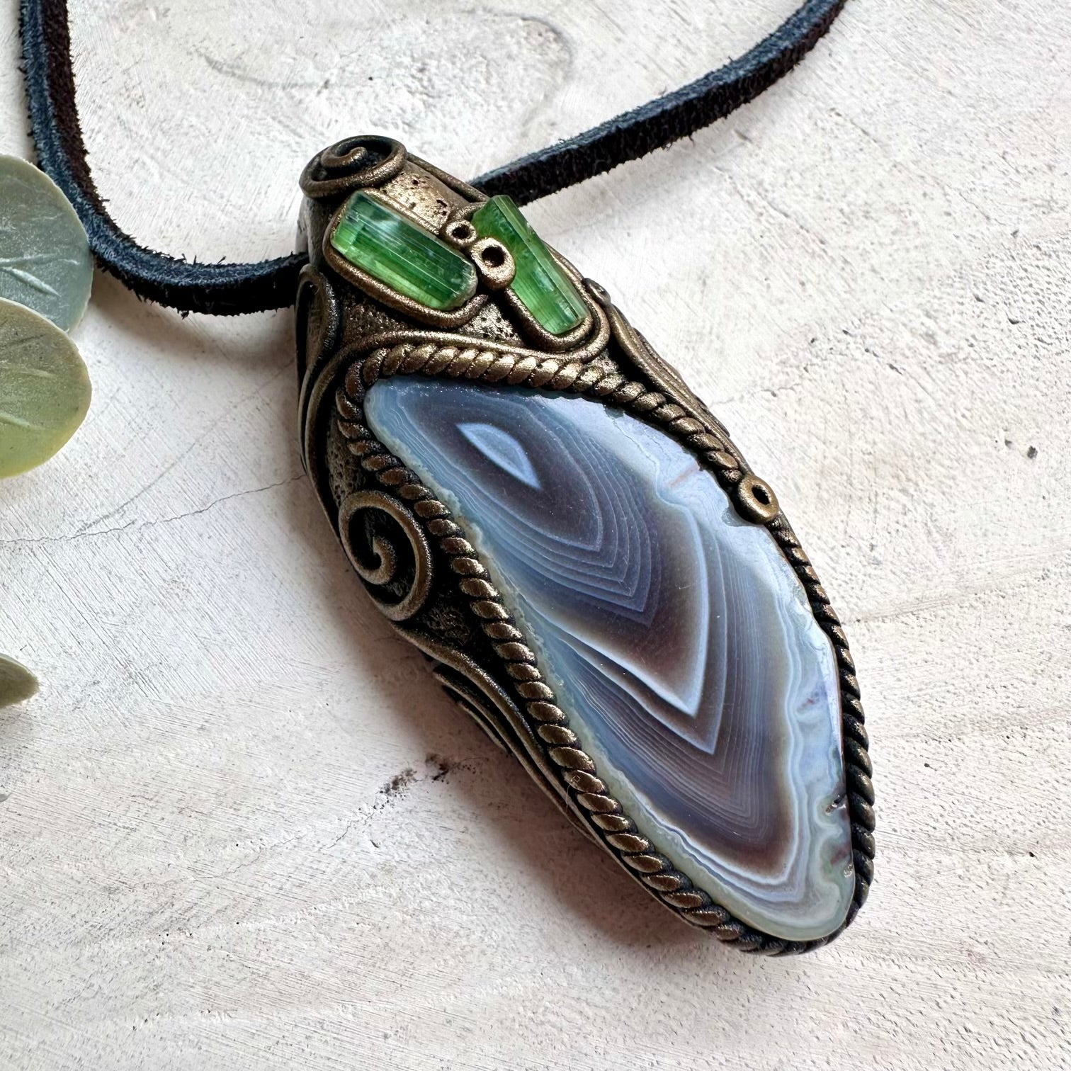 Metaphysical jewelry necklace with Botswana Agate and Green Tourmaline crystal pendant for chakra healing.