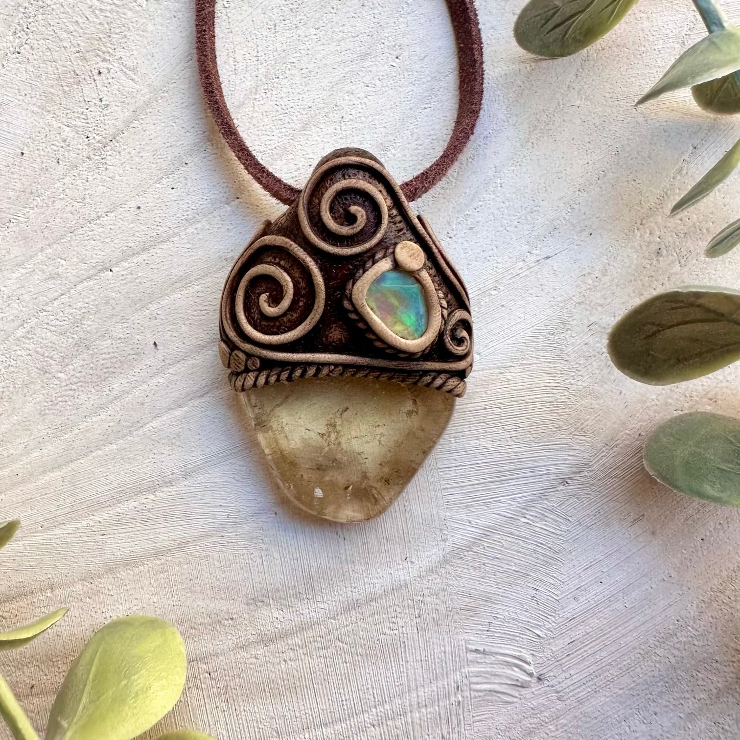 Citrine crystal paired with raw Ethiopian opal in a pendant