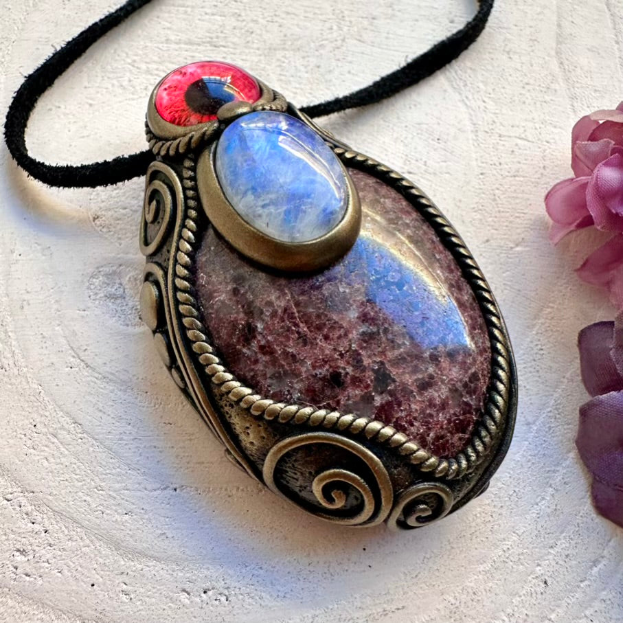 Festival-ready unisex healing necklace with ethically sourced Red Garnet and glowing Rainbow Moonstone protective eye symbol.