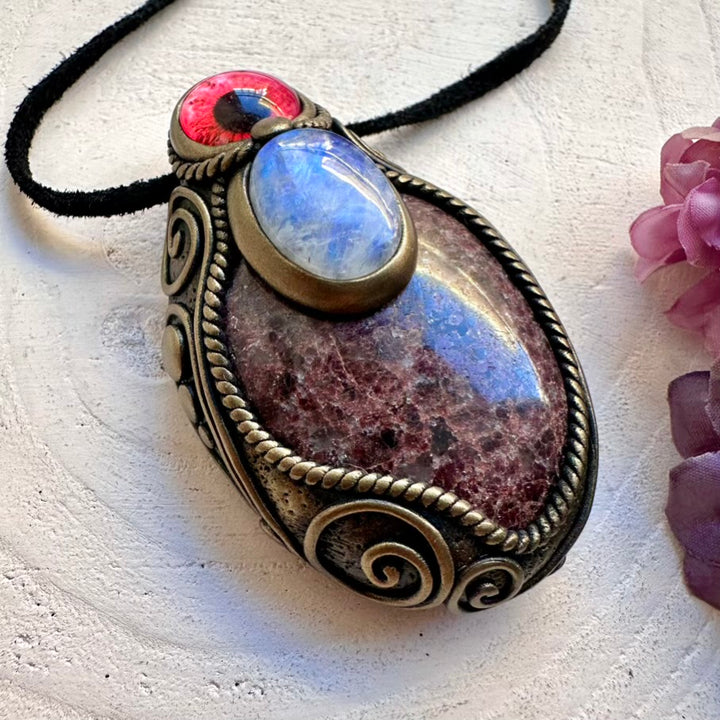 Festival-ready unisex healing necklace with ethically sourced Red Garnet and glowing Rainbow Moonstone protective eye symbol.