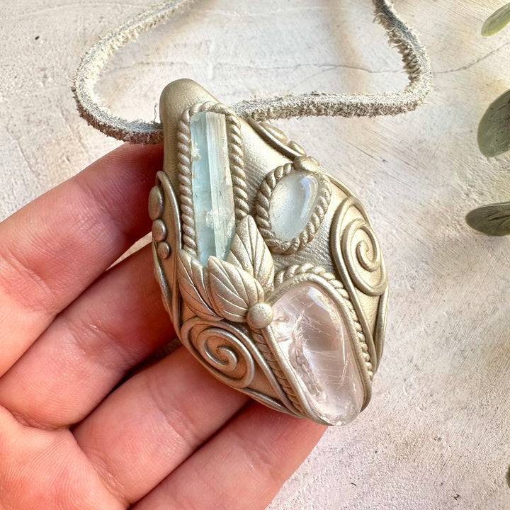 Handmade crystal pendant combining natural Aquamarine with Danburite and Clear Topaz.