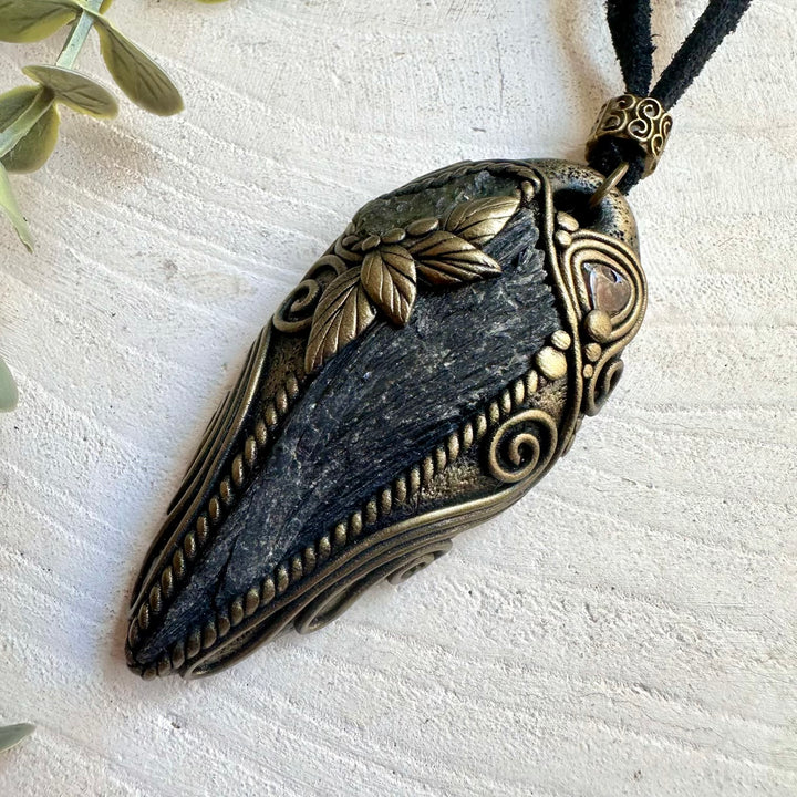 Boho crystal jewelry featuring Black Kyanite, Moldavite and Red Garnet in an artisan setting.