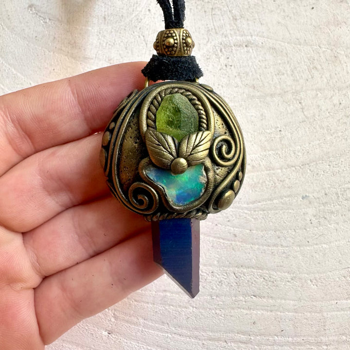 Handmade crystal necklace with vibrant Cobalt Aura Quartz and natural gemstone details.