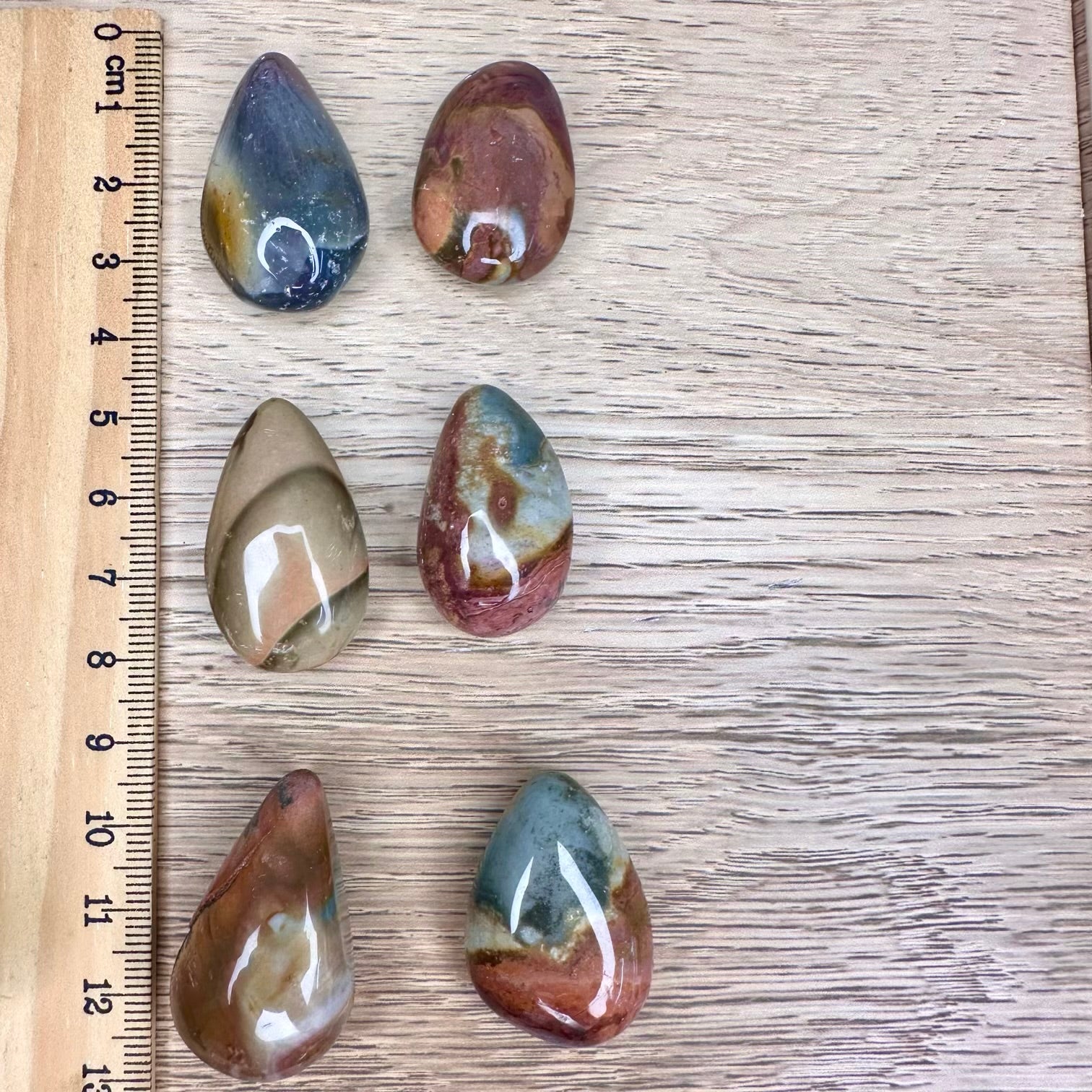 Polychrome jasper gemstone in teardrop shape