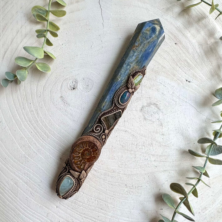 Handcrafted spiritual wand featuring six distinctive natural stones traditionally associated with intuition, grounding, clarity, transformation and renewal.