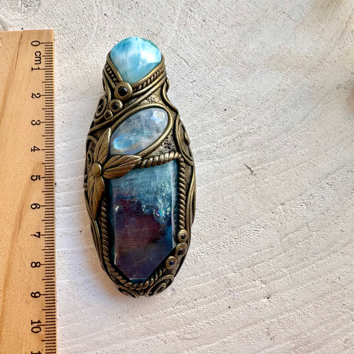 Handmade crystal talisman necklace featuring Aqua Aura Quartz, Larimar, Rainbow Moonstone and Blue Sapphire.