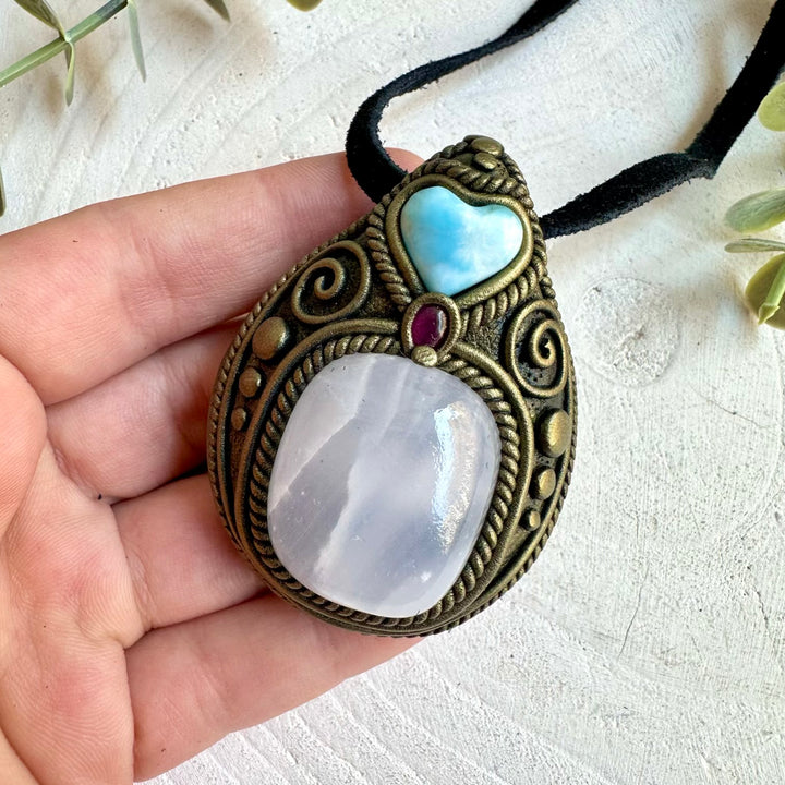 One of a kind crystal necklace with warm Mango Calcite and a beautiful Larimar Heart.