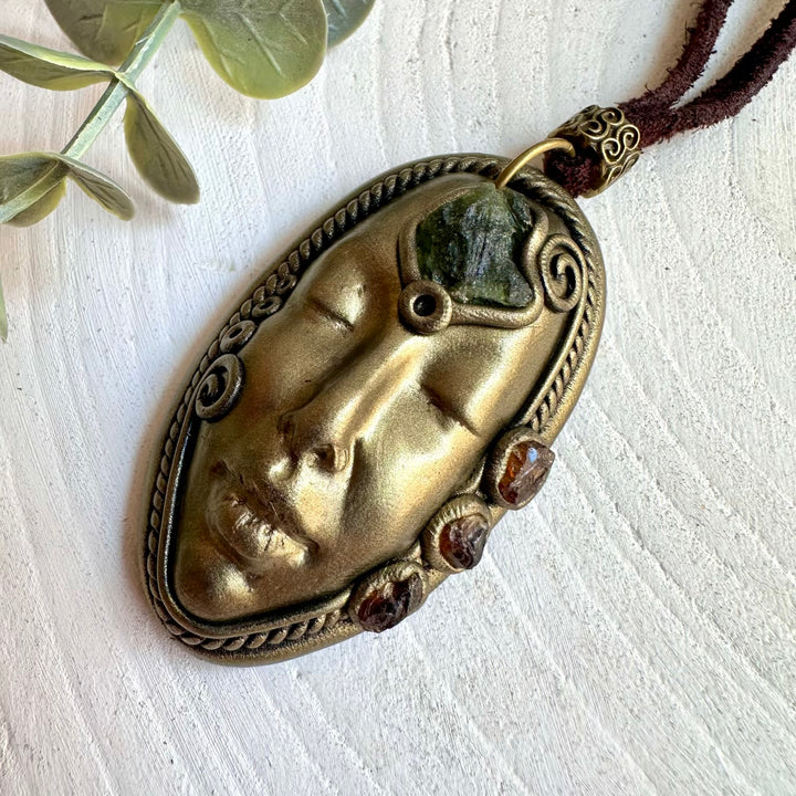 Artisan pendant necklace showcasing Moldavite with a natural Hessonite Garnet gemstone.