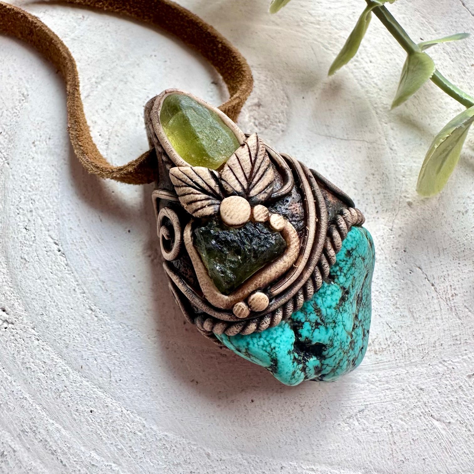 Spiritual crystal necklace featuring Moldavite, Peridot and Turquoise for transformation and balance