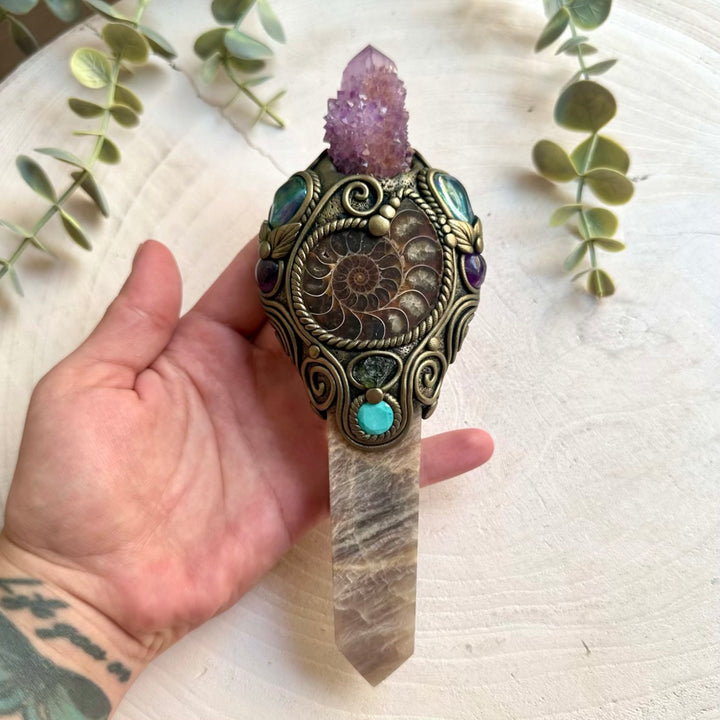 Spiritual crystal tool featuring Moonstone with Ammonite, Aqua Aura Quartz and Amethyst accents.