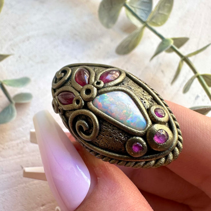 Unique handmade jewelry showcasing Australian Opal and vibrant red gemstones.