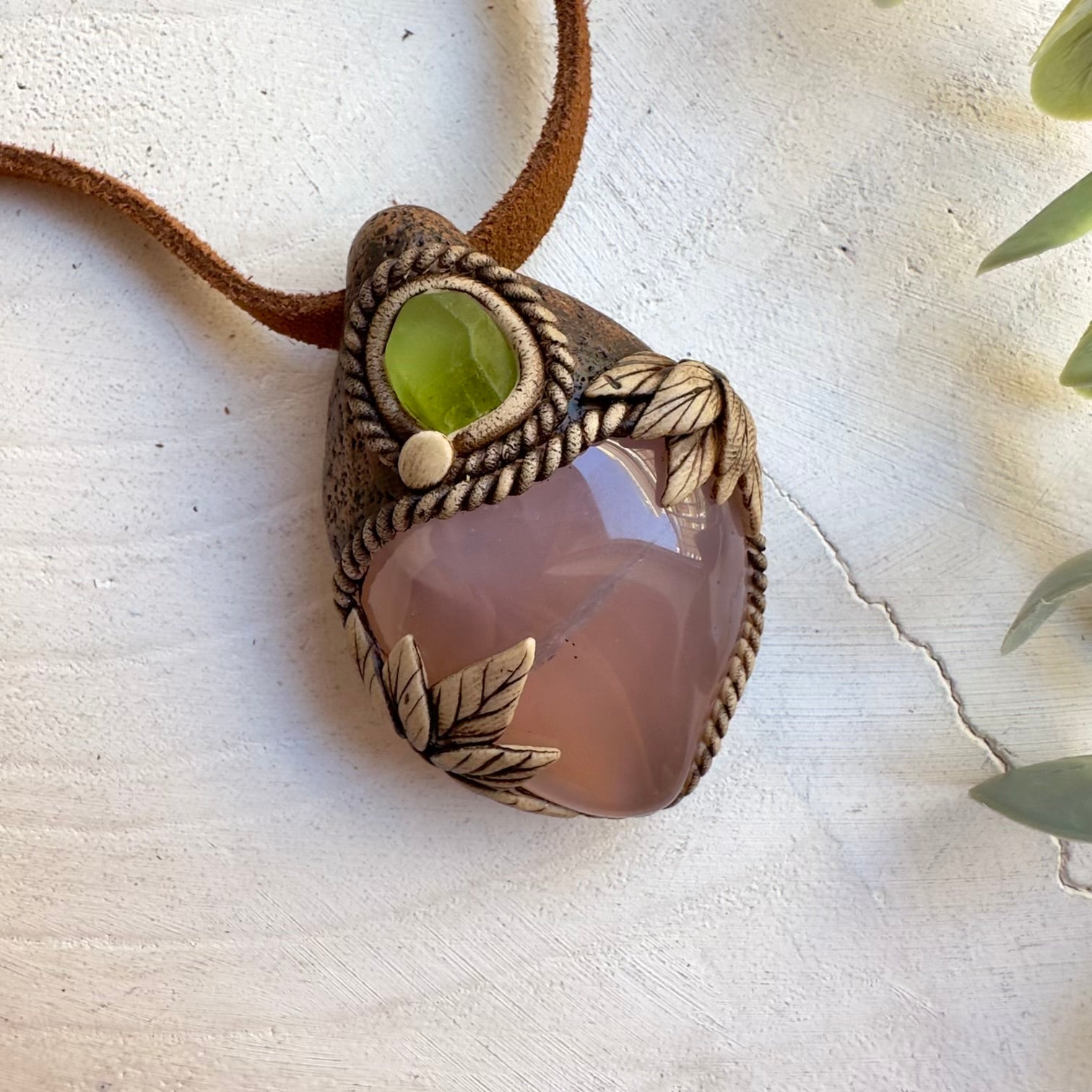 Handmade gemstone necklace featuring pink chalcedony and peridot