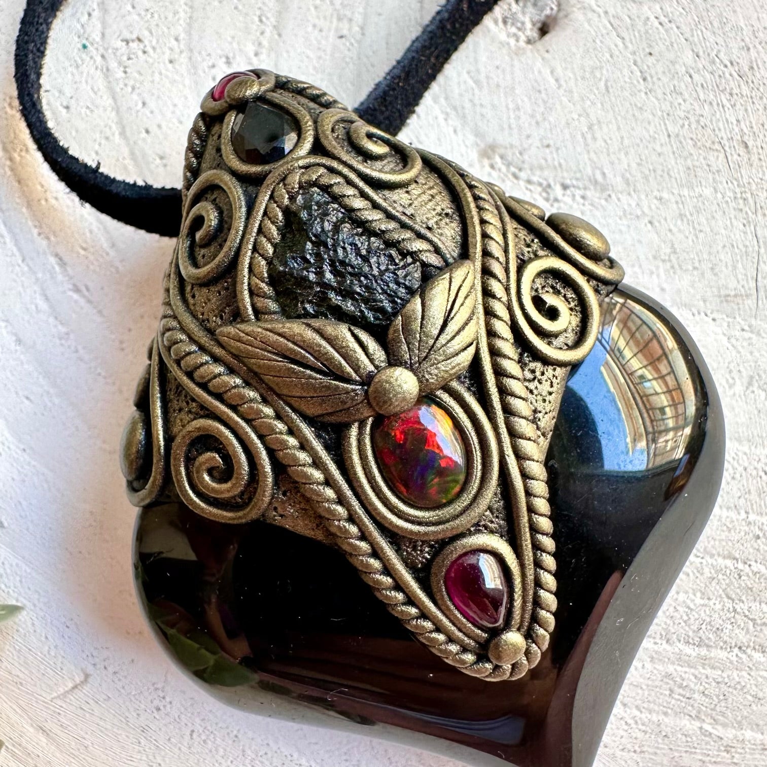 Metaphysical healing crystal necklace combining Rainbow Obsidian with Smoky Quartz and natural gemstones.