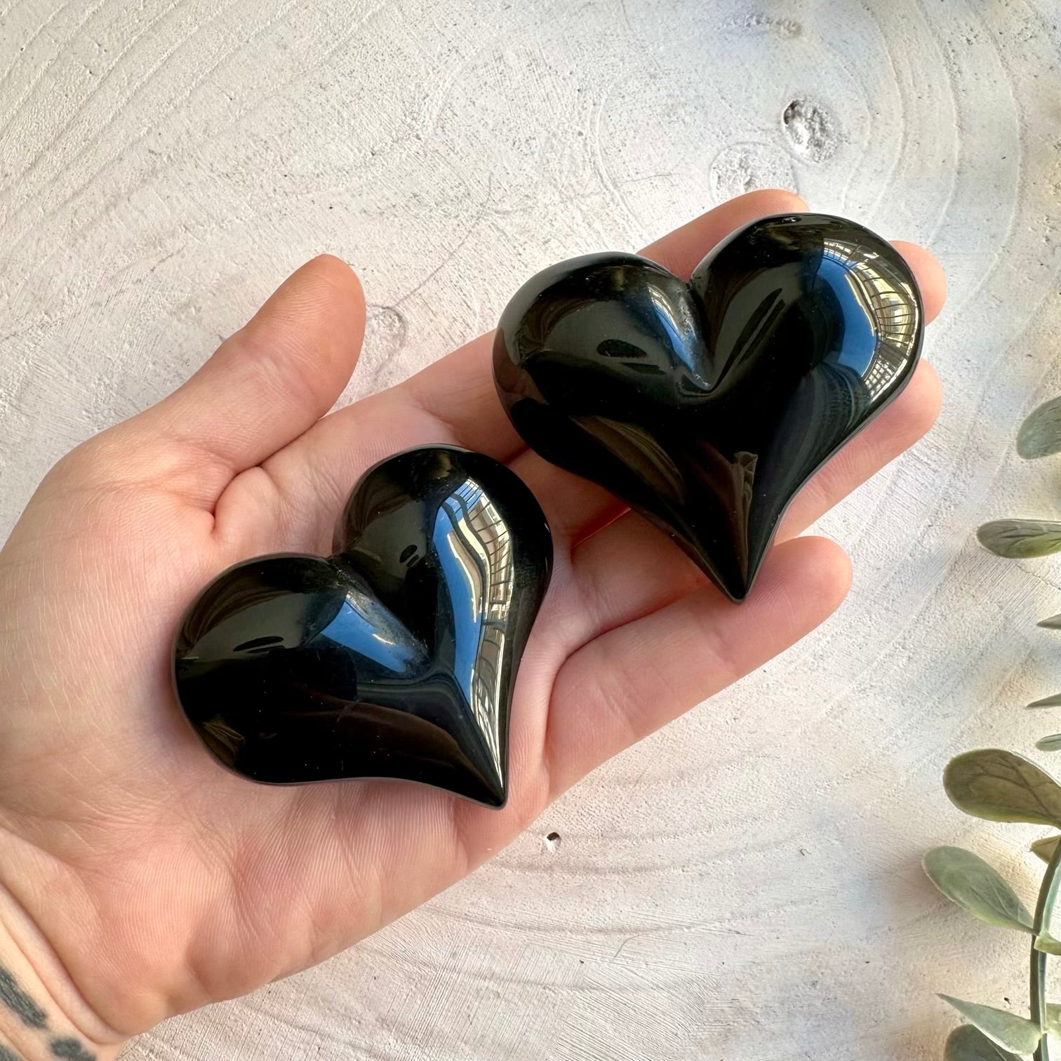 Polished rainbow obsidian heart stone carving